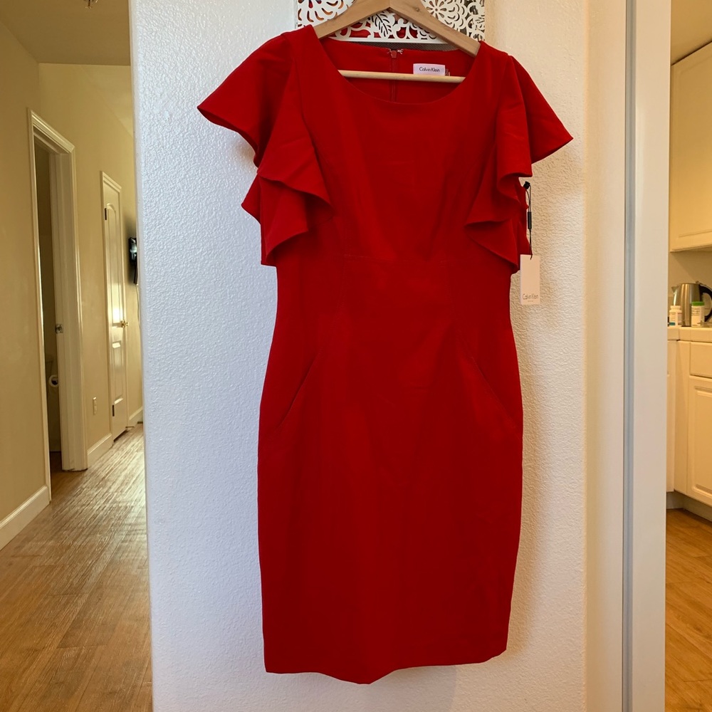 Red, ruffle sleeved dress with pockets.